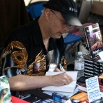 Word on the Street: Robert J. Sawyer Autographing a Book for a Fan