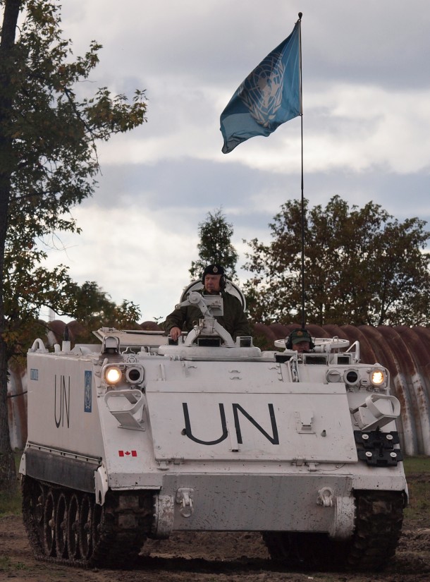 White UN Troop Carrier Underway