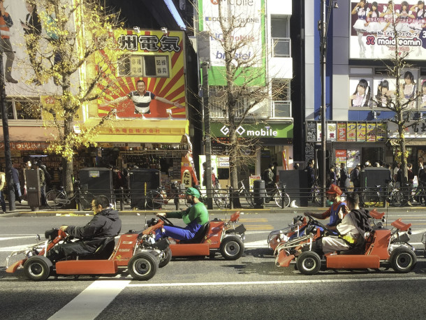 People Mario Karting in Akihabara