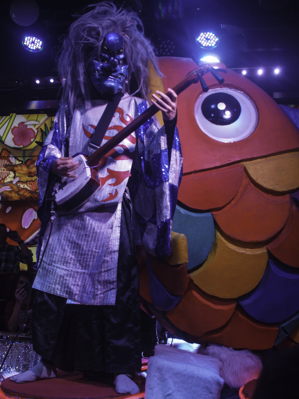 Robot Restaurant - Blue Demon-faced Character Playing Electric Shamisen