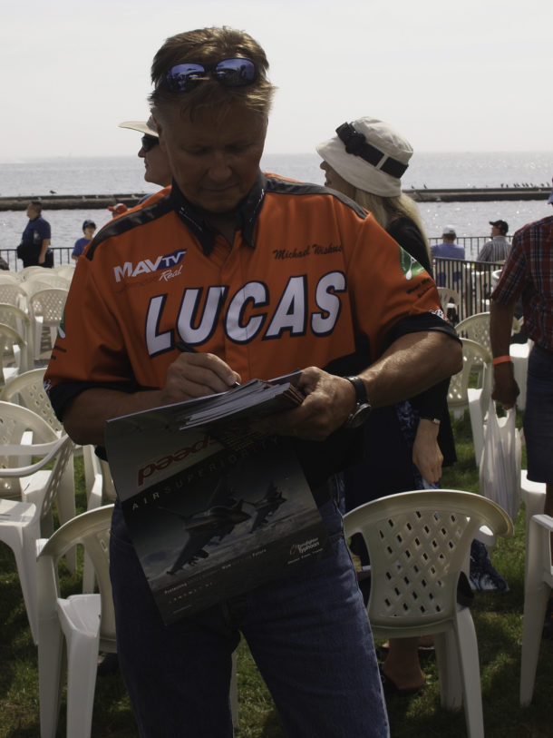 Mike Wiskus Autographing a Calendar for a Fan